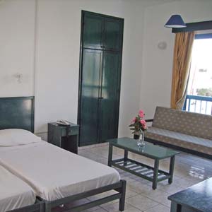 3 person superior studio with inland view, balcony, an extra bed, and private facilities (bath and shower)